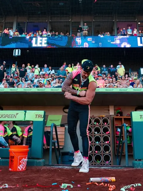 Sam Hanson flexing in the dugout in neon Cosmic gear — Instagram post from July 27, 2026